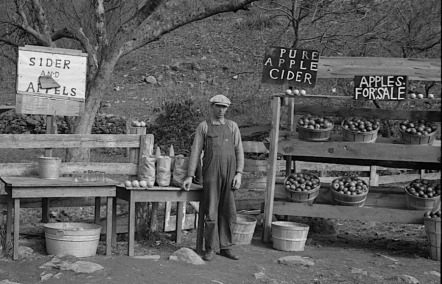selling apple products at a roadside stand to tourists in the 1930's