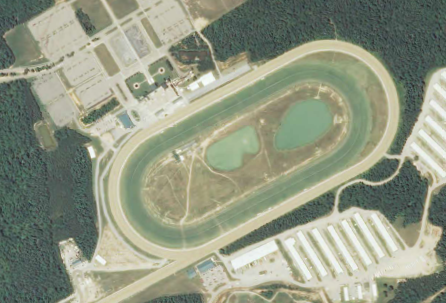 Colonial Downs has a grass track for Thoroughbred races inside the dirt oval for harness races