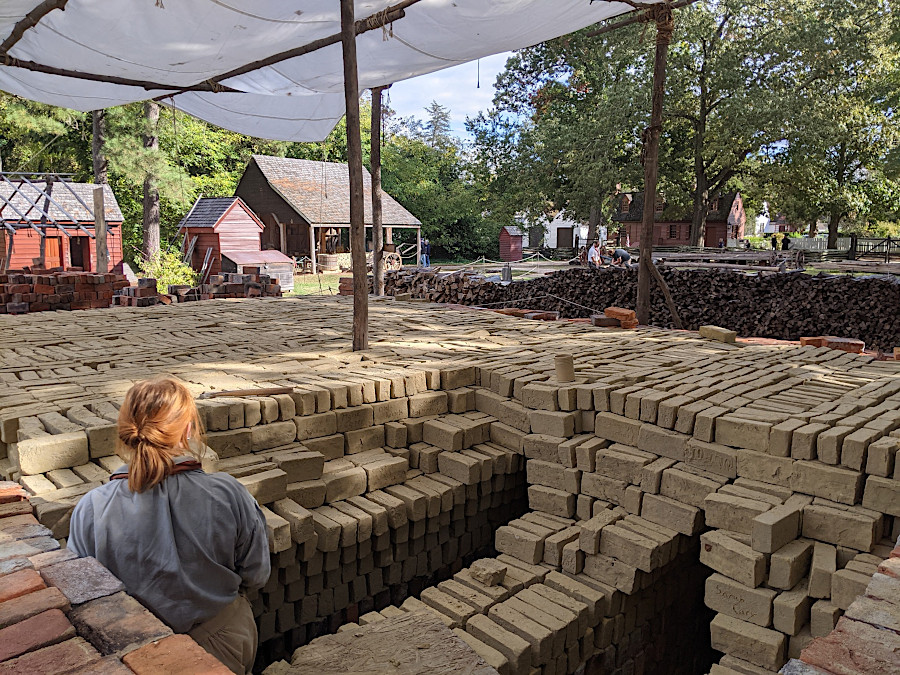 dried mud bricks are stacked to create a kiln, inside which the bricks will be heated to 2,000°F