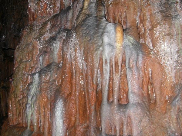 cave flowstone at Grand Caverns, Virginia created by white calcite and red iron oxide (rust) precipitating from groundwater