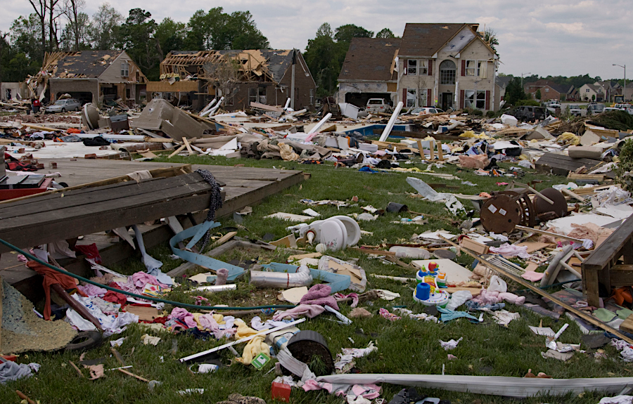 tornadoes knock down trees in the forest and houses in the suburbs