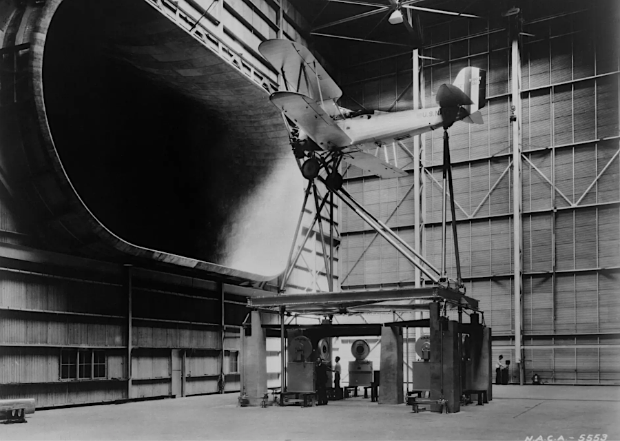 the Full-Scale Tunnel under construction in 1930, testing a full-sized Navy plane in 1931, and in 1979