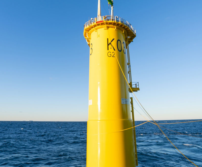 yellow transition pieces between the underwater monopoles and towers allow technicians to climb up inside the tower to maintain turbines