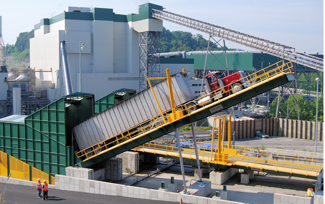 trucks deliver wood chips to the Virginia City Hybrid Energy Center
