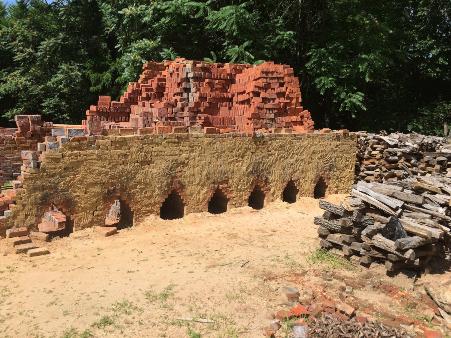 Colonial Williamsburg uses a wood-fired kiln each Fall to heat bricks hot enough so the clay becomes waterproof