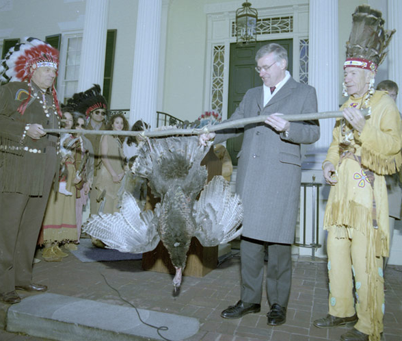 Governor Baliles receives payment at Governor's Mansion in Richmond, 1989