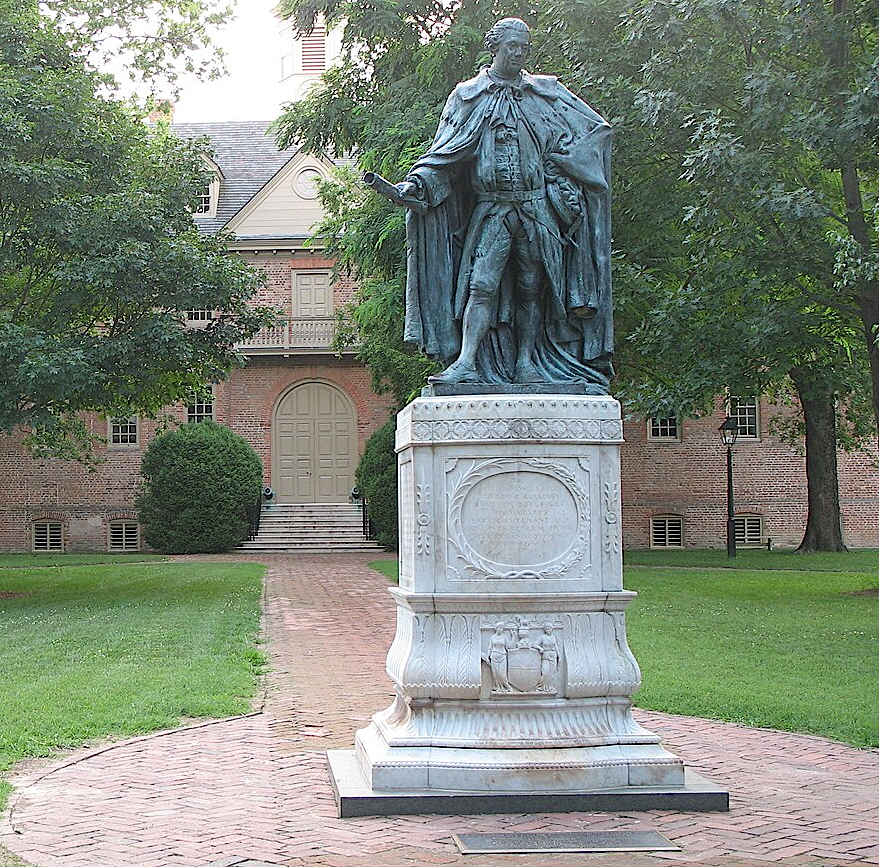 a bronze replica of the marble statue of Governor Botetourt stands outside the Wren Building at the College of William and Mary