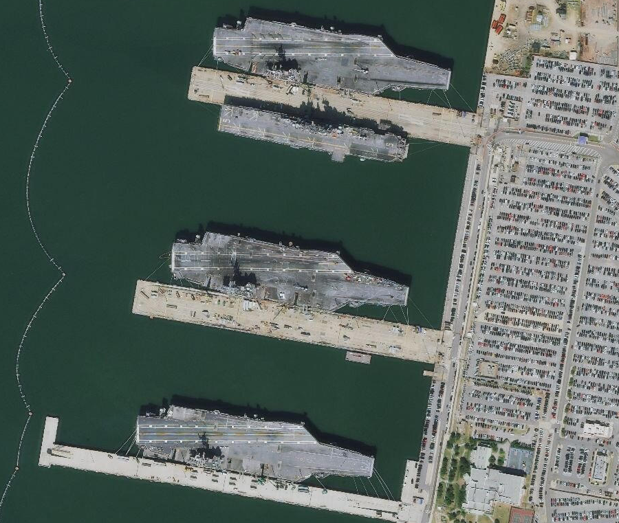 three aircraft carriers at Naval Station Norfolk
