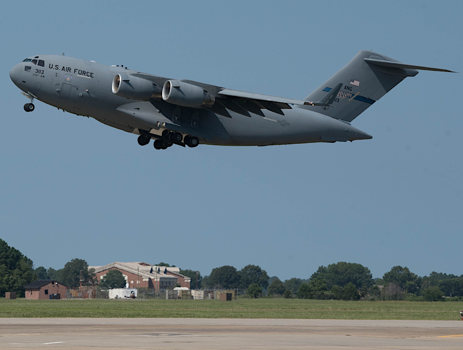 US Air Force C-17 Globemaster III transporting vehicles in a 2019 training exercise involving National Guard, Army, Navy, and Air Force