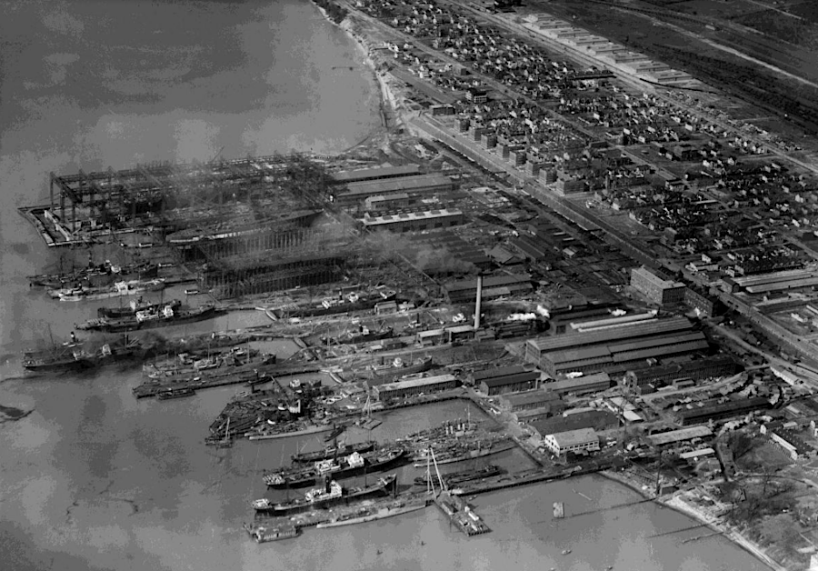 machine shop buildings at the shipyard (in middle right of 1920 photograph) date back to 1890