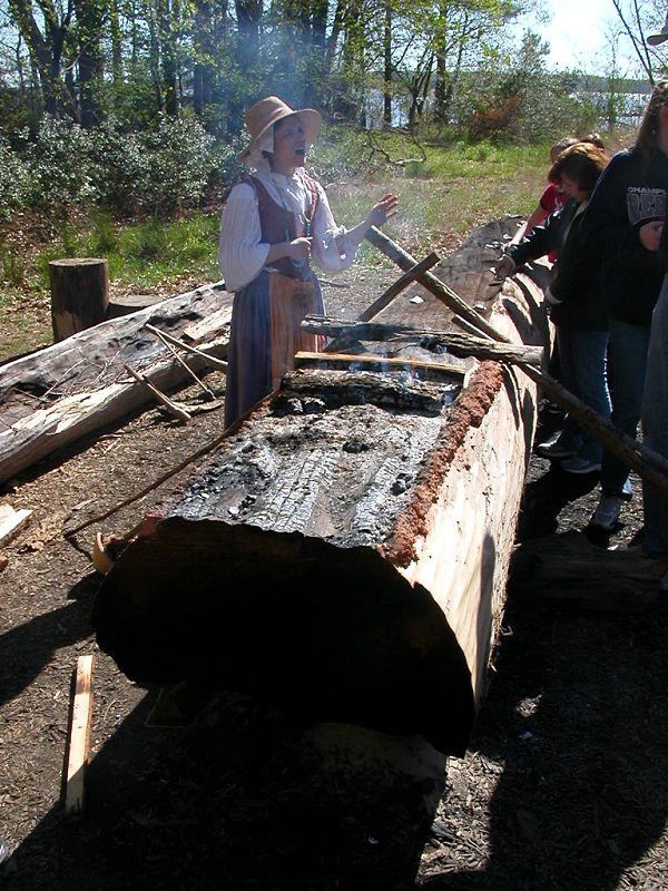 interpreter explaining canoe construction with fire and scraping, at Jamestown Settlement