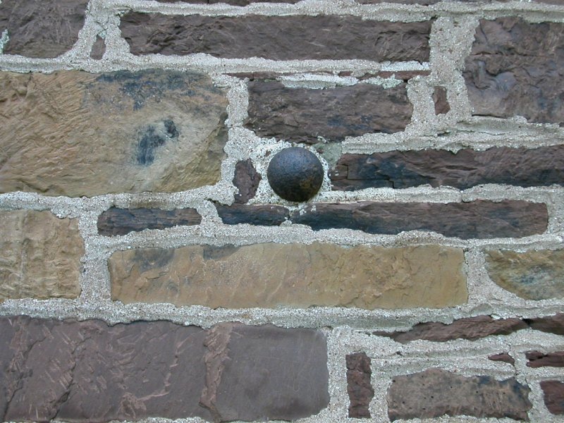 cannonball inserted into wall of Stone House on Manassas Battlefielld after Civil War, to generate tourist traffic