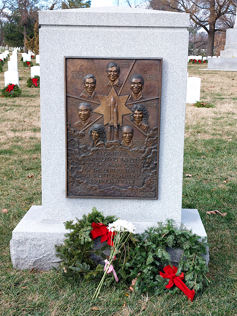 the comingled cremated remains of the seven Challenger astronauts are in Section 46, Grave 1129