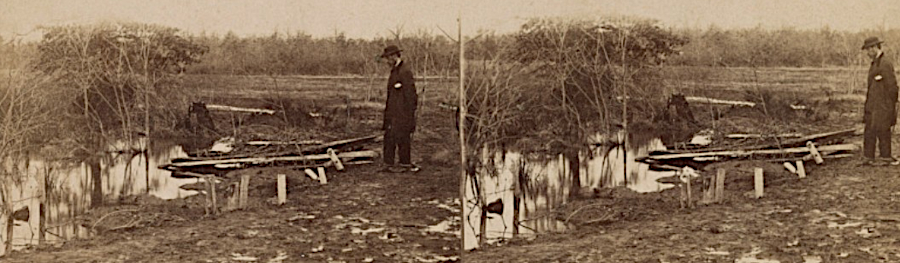 a stereoscope image of a burial at Manassas, with temporary grave markers