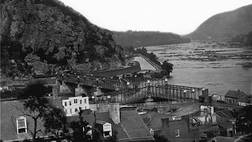 the 1870 iron truss bridge retained the track alignment implemented first in 1839, still requiring B&O trains to make a sharp turn in Harpers Ferry