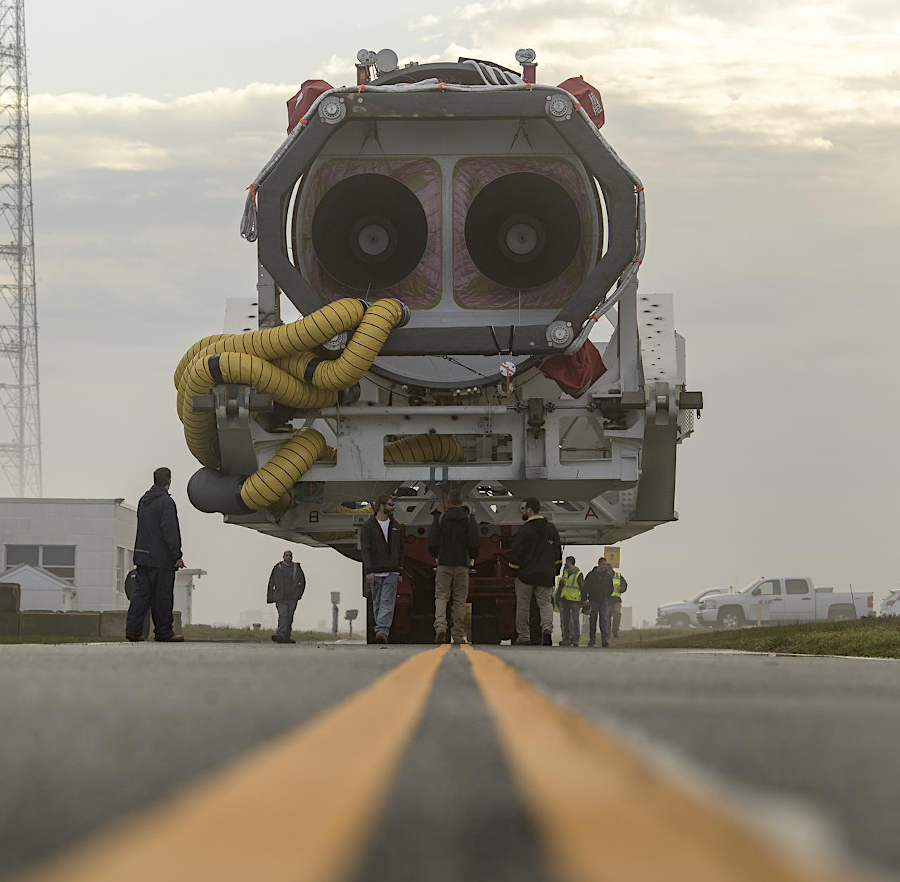 the Antares rocket is carried horizontally to the launch pad, then lifted into vertical position for launch