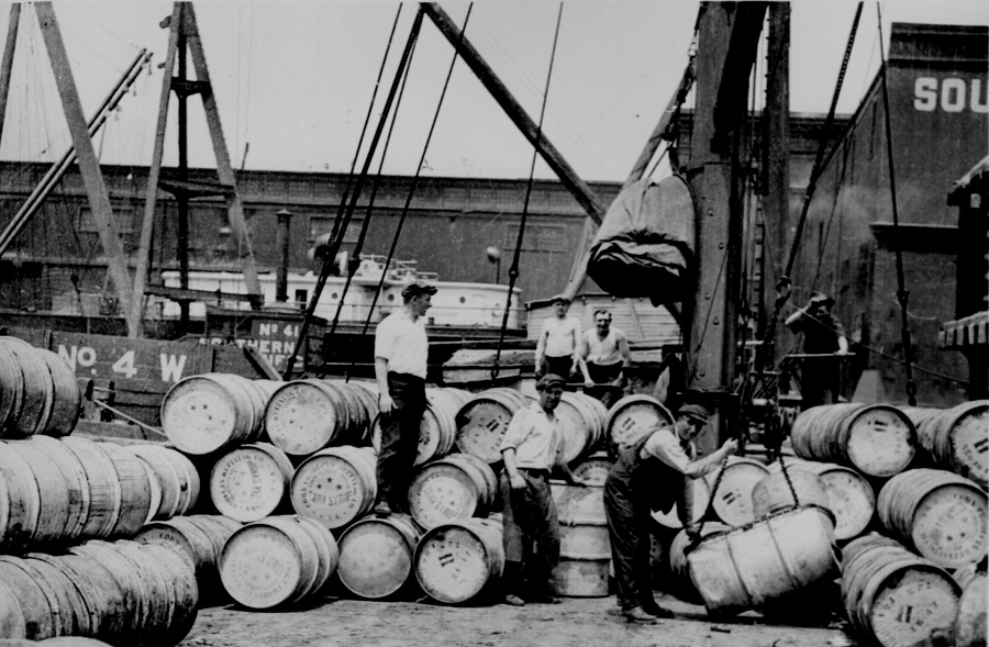 more longshoremen were required to load/unload cargo in individual barrels vs. 40' containers moved by gantry cranes