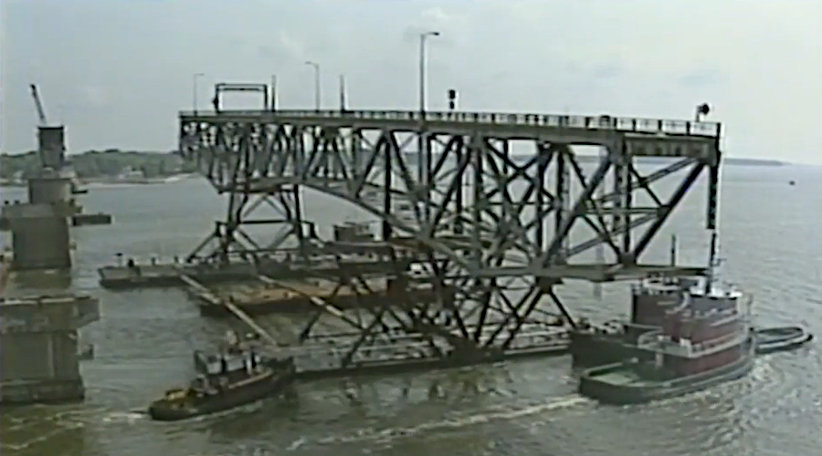 swing span of the 1952 two-lane bridge on the Yorktown end, after removal and on the way to Norfolk