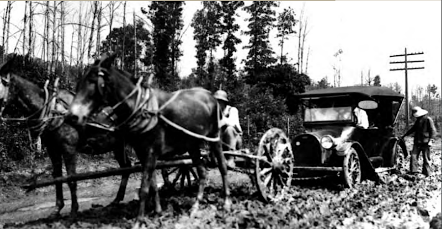until roads were paved, farmers could earn extra money pulling cars out of muddy spots