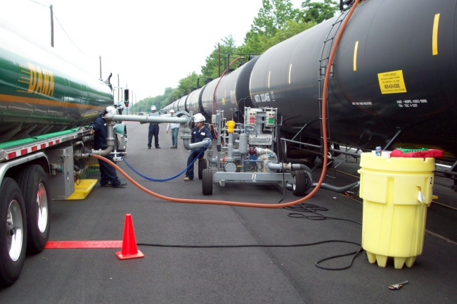 transferring ethanol from rail car to tanker truck, for transport to a tank farm where ethanol will be blended with gasoline for final shipment by truck to gas stations