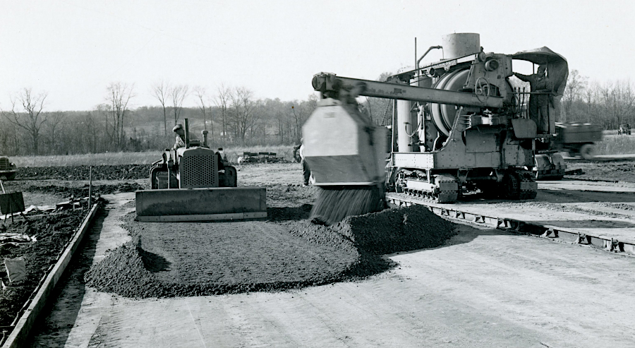 construction crews lay down a base course of rock to provide a solid foundation, before asphalt pavement is placed on top