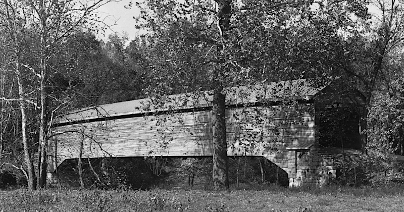 the Virginia Department of Transportation rebuilt Meems Bottom Covered Bridge, with concrete piers and steel girders, after arsonists burned the historic covered bridge in 1976