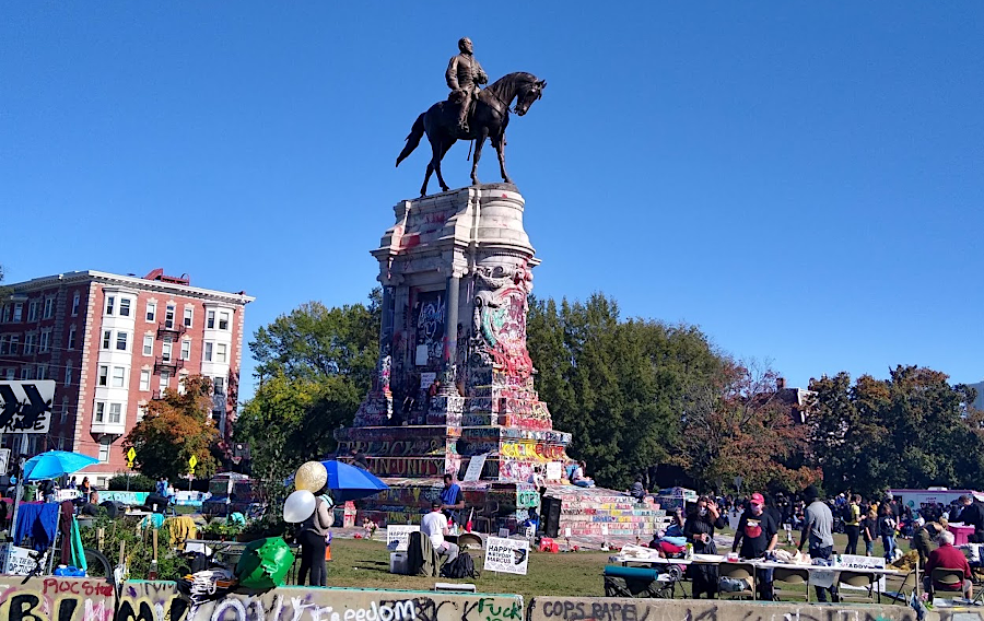 the grafitti-covered Lee Monument was scene of celebration of what would have been Marcus-David Peters' 27th birthday on October 17, 2020