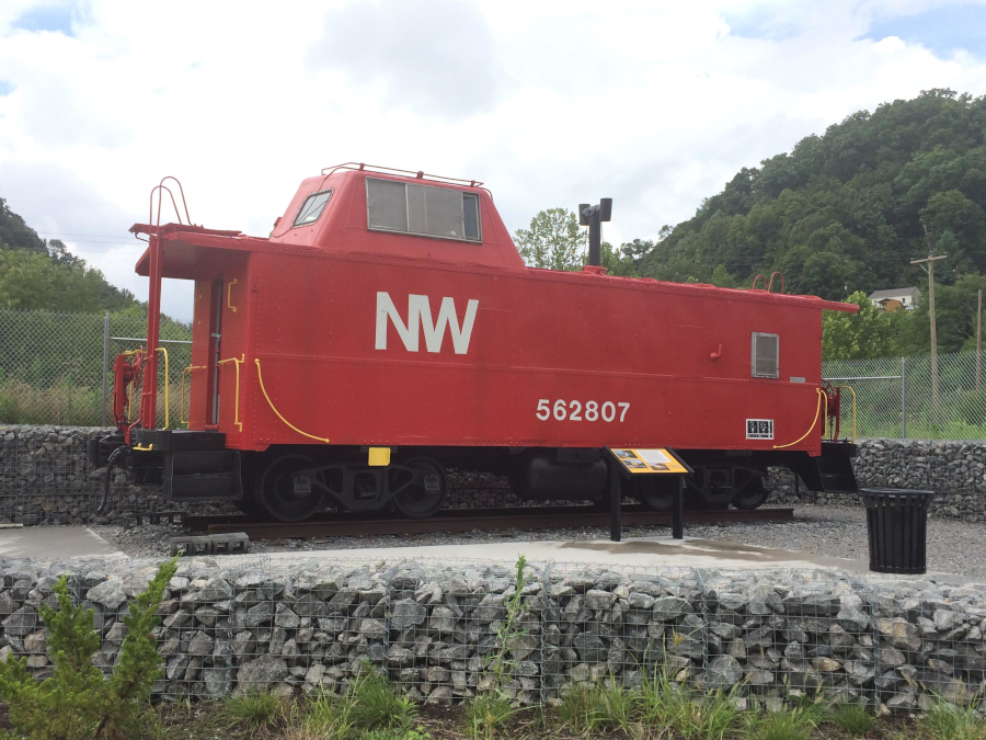 a Norfolk and western Railroad caboose is parked at the end of the Powell River Trail in Appalachia