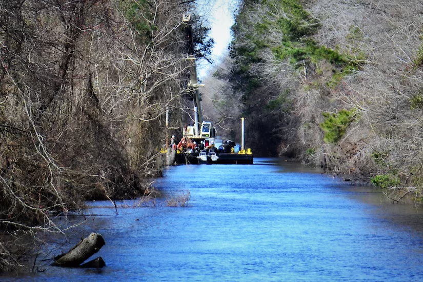 materials excavated from the Dismal Swamp Canal feeder ditch are placed in an adjacent upland placement site