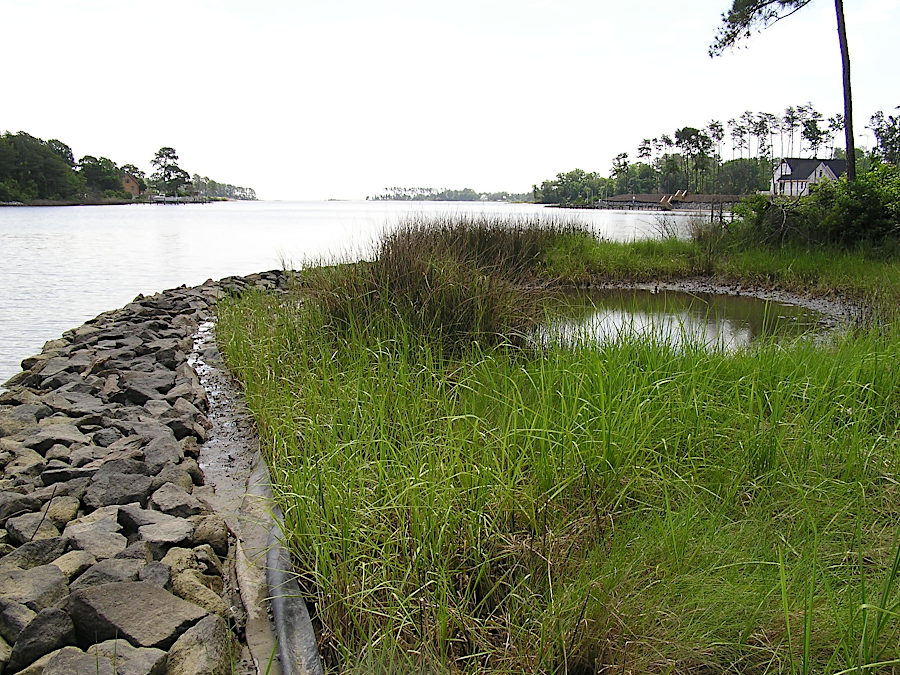 organic material can be exchanged through porous rock barriers, part of a living shoreline that reduce shoreline erosion