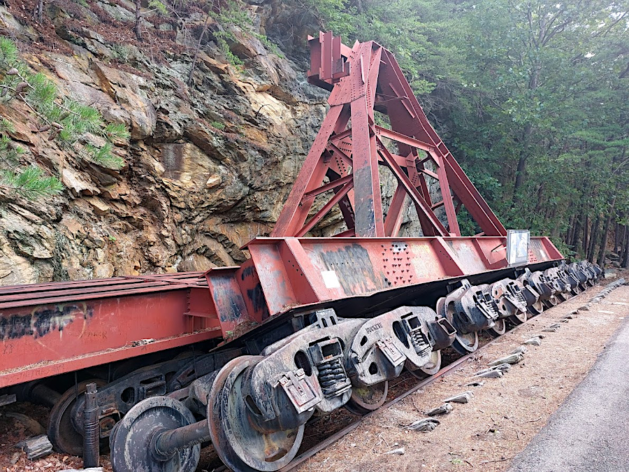 a rail system adjusted the location of a thick wire over the Staunton/Roanoke River canyon, from which materials were lowered to construct Smith Mountain Lake dam